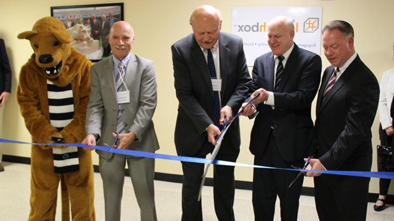  The ribbon-cutting ceremony included (left to right) Randy Peers, John Morahan, Dr. R. Keith Hillkirk, Dr. Neil Sharkey, and the Nittany Lion